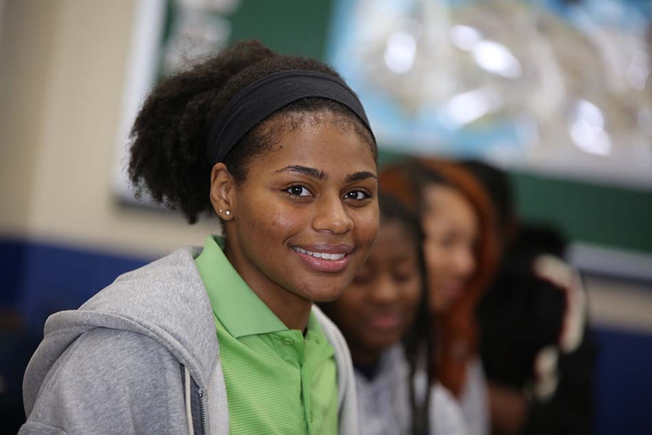 students and teacher working in classroom